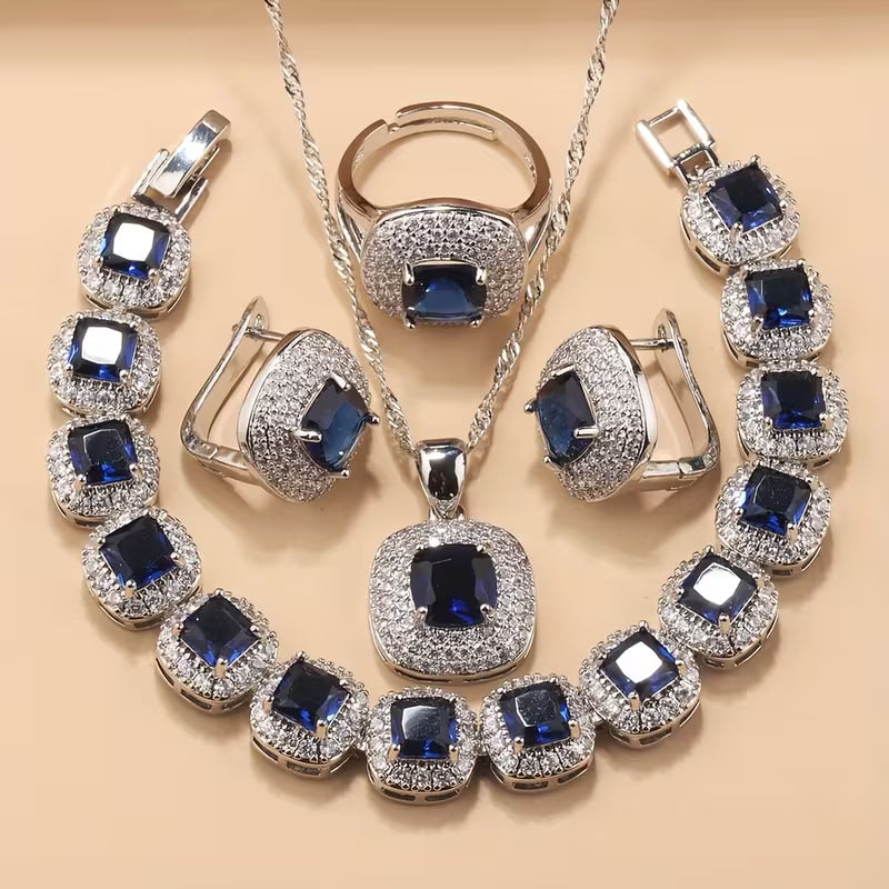 A Newly Designed Square Zirconia Fashion Jewelry Set for Women, Including Earrings, a Necklace with a Pendant, a Bracelet, And an Adjustable Ring Suitable for Various Occasions