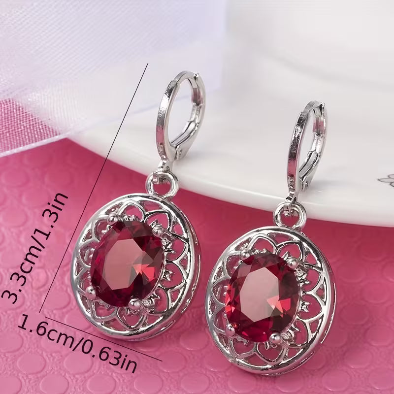 A Pair of Hollowed-out Petal Earrings with Egg-shaped Inlays, a Commemorative Gift