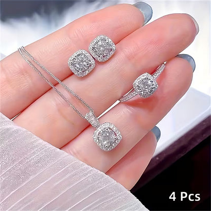 A Set of 4 Sparkling Cubic Zirconia Jewelry Pieces! This Combination Includes a Necklace Pendant, Ring, And Earrings, Showcasing Exquisite Cuts That Radiate Brilliance. It'S Stylish And Versatile, Perfect for Various Occasions