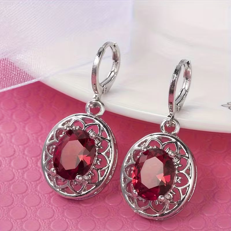 A Pair of Hollowed-out Petal Earrings with Egg-shaped Inlays, a Commemorative Gift