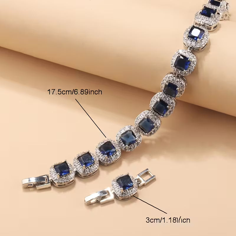 A Newly Designed Square Zirconia Fashion Jewelry Set for Women, Including Earrings, a Necklace with a Pendant, a Bracelet, And an Adjustable Ring Suitable for Various Occasions