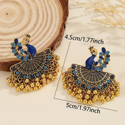 A Pair of Jhumka Peacock Earrings with Bells And Tassels, Stylish And Vintage Additions Suitable for Women to Wear Daily, During Festivals, Weddings, And Parties, Or As Jewelry Gifts