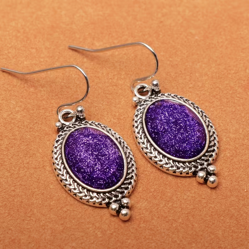 A Pair of Alloy Earrings Inlaid with Purple Oval Resin