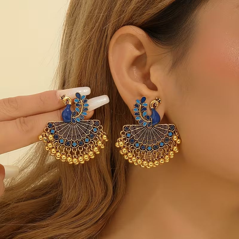 A Pair of Jhumka Peacock Earrings with Bells And Tassels, Stylish And Vintage Additions Suitable for Women to Wear Daily, During Festivals, Weddings, And Parties, Or As Jewelry Gifts