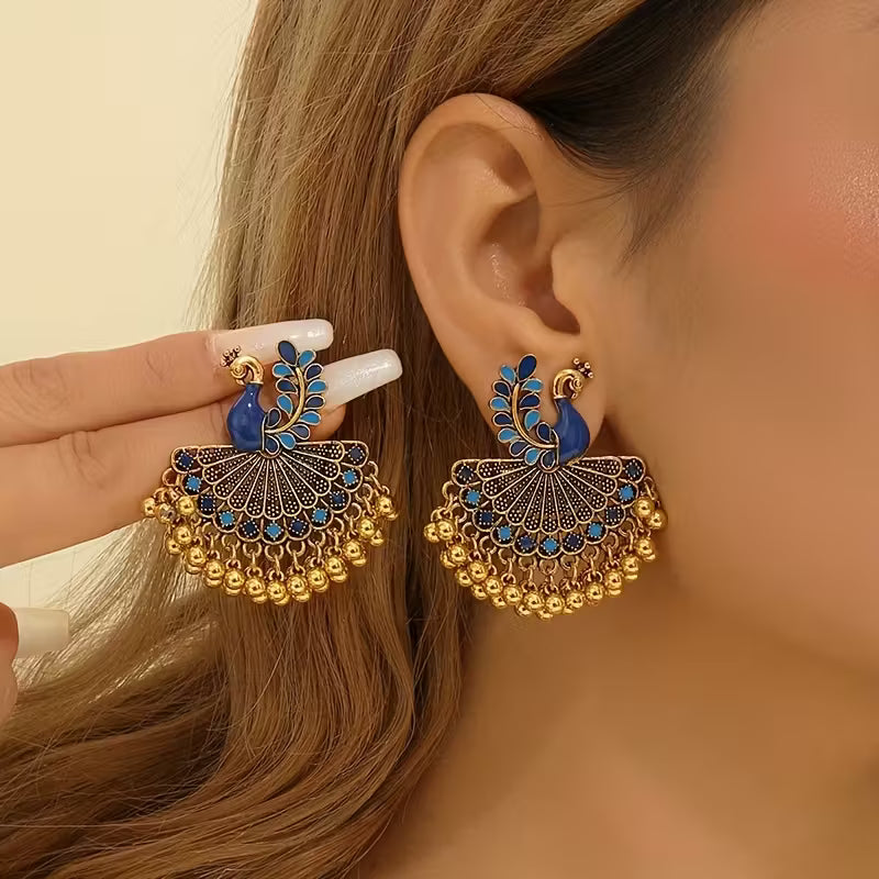 A Pair of Jhumka Peacock Earrings with Bells And Tassels, Stylish And Vintage Additions Suitable for Women to Wear Daily, During Festivals, Weddings, And Parties, Or As Jewelry Gifts
