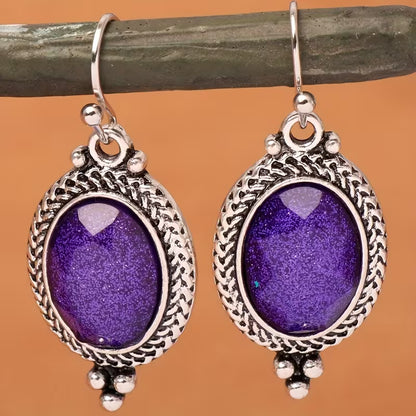 A Pair of Alloy Earrings Inlaid with Purple Oval Resin